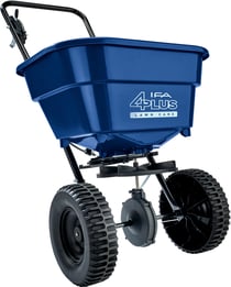A blue IFA 4Plus broadcast spreader for home fertilizing.