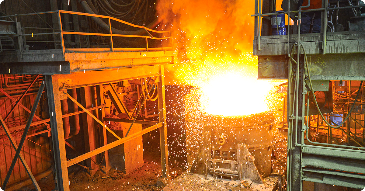 A steel foundry with white hot molten metal.